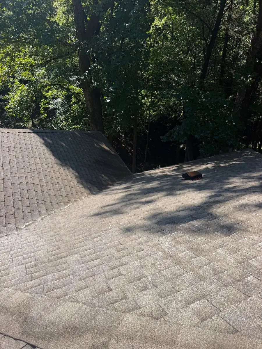 Asphalt shingle roof soft washing in progress in Blowing Rock