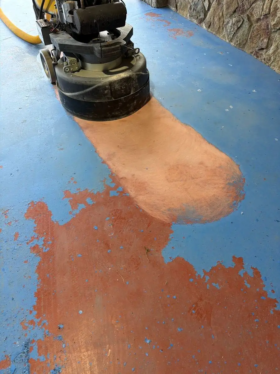 Floor grinder removing an old coating in Boone