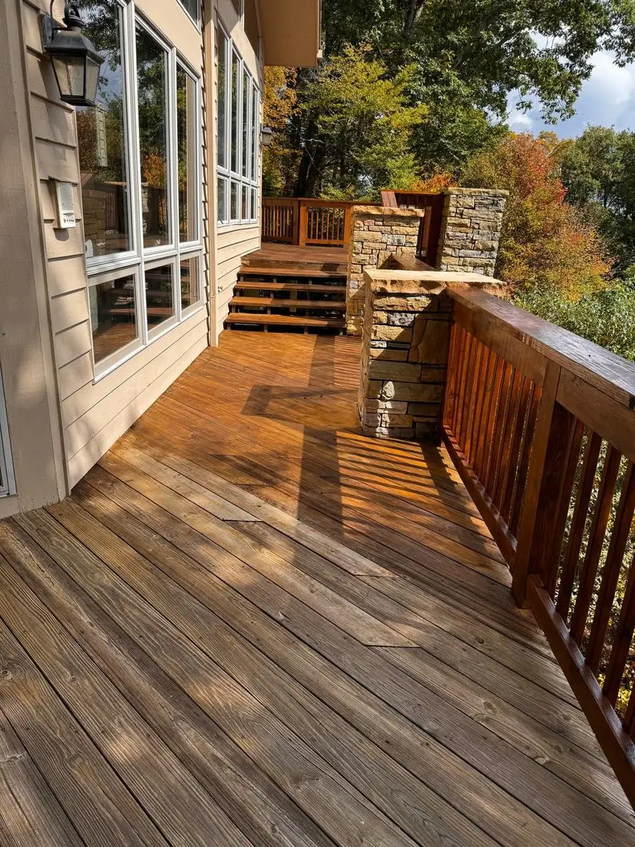 Deck with stone columns partway through staining at Linville Ridge in Linville