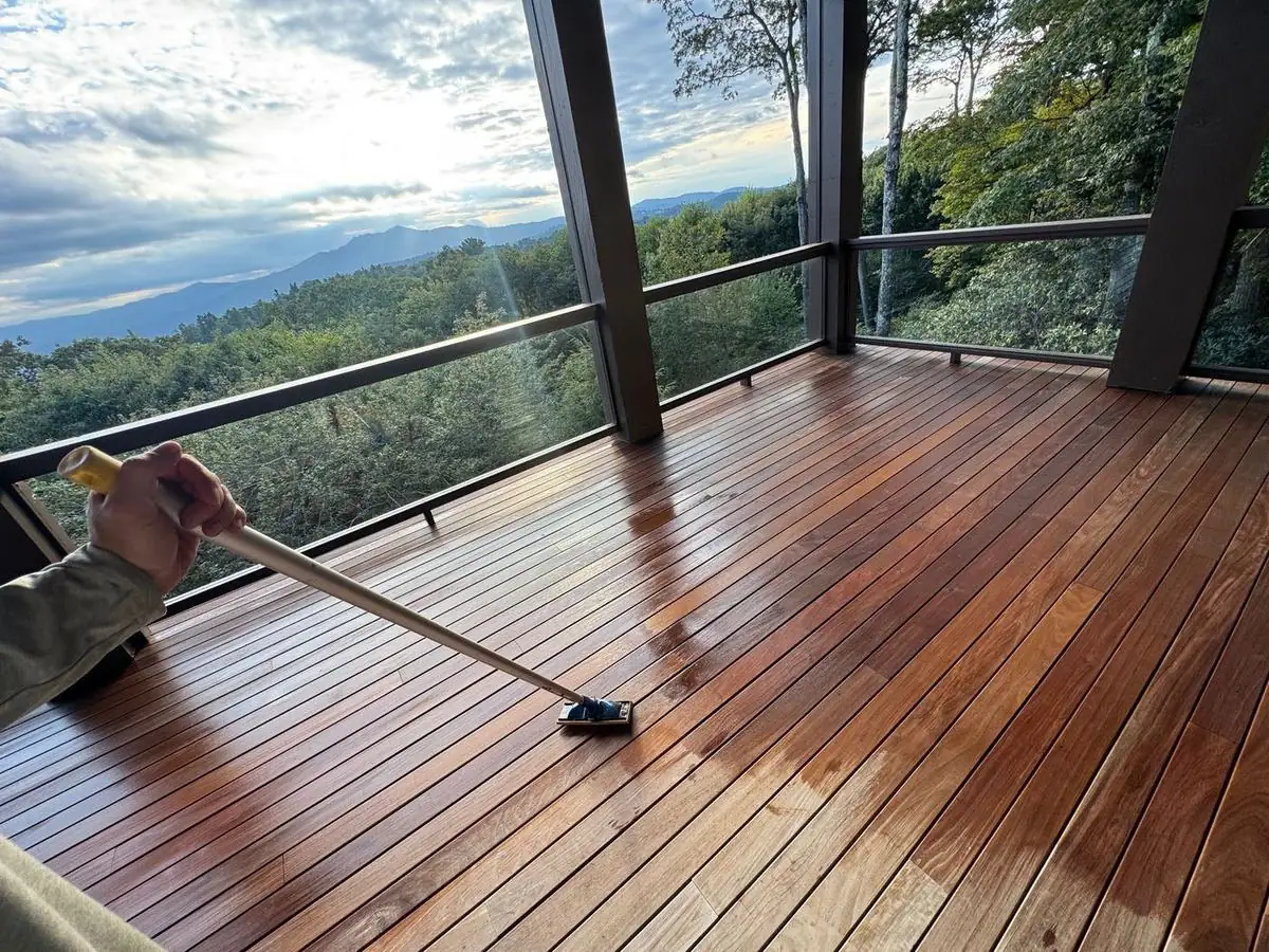 Oil being applied to an ipe deck