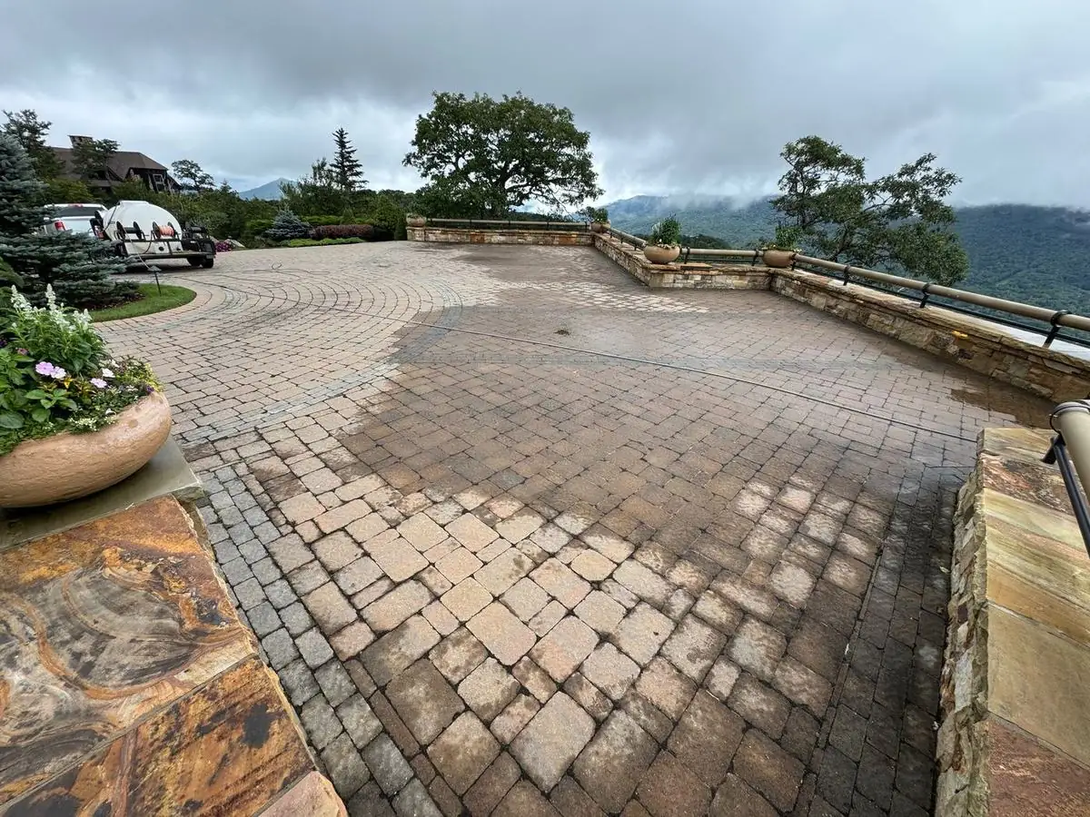 Large paver driveway half cleaned
