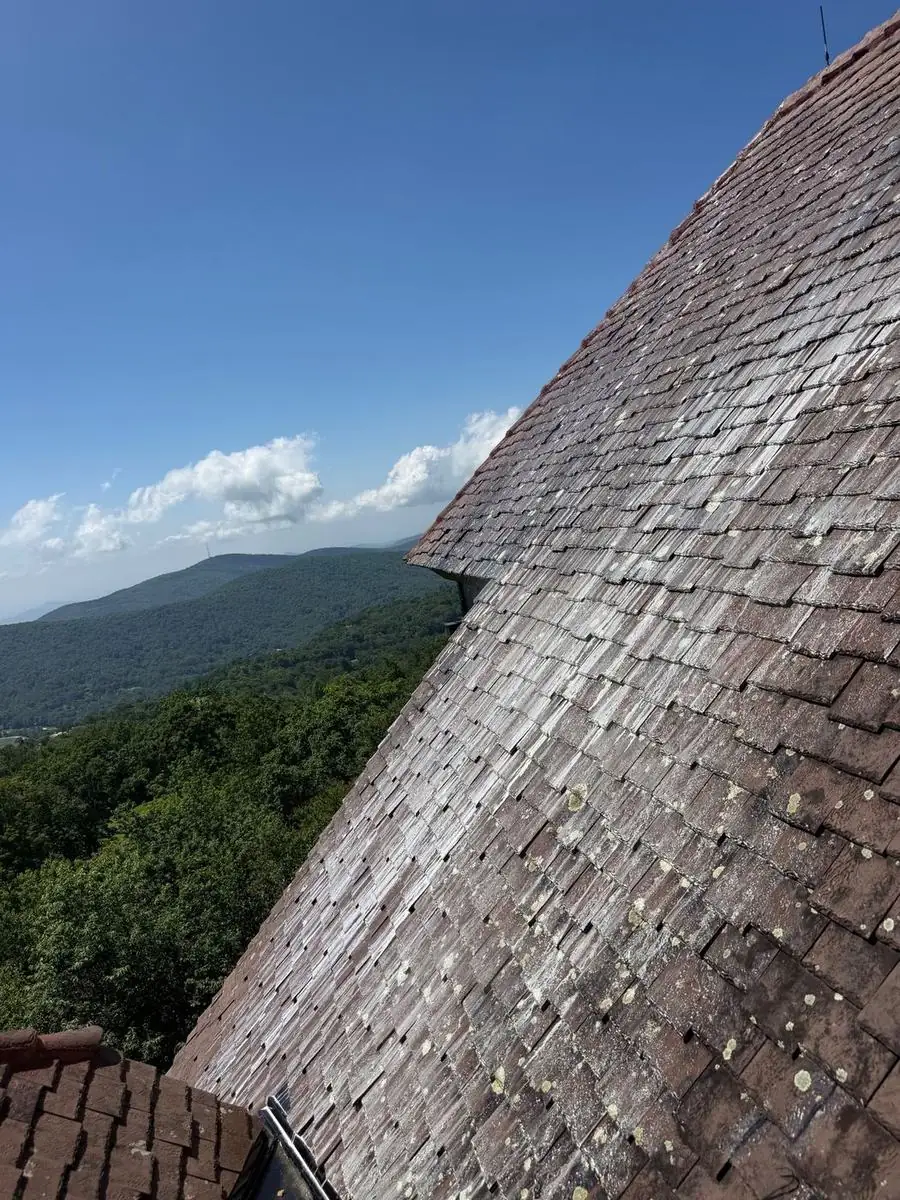 Stone tile roof covered in lichen and algae before cleaning at Linville Ridge in Linville