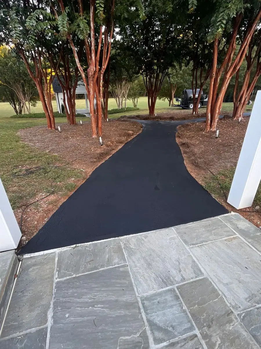 Freshly sealed asphalt walkway