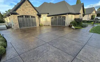 Sealed stamped concrete driveway two car garage