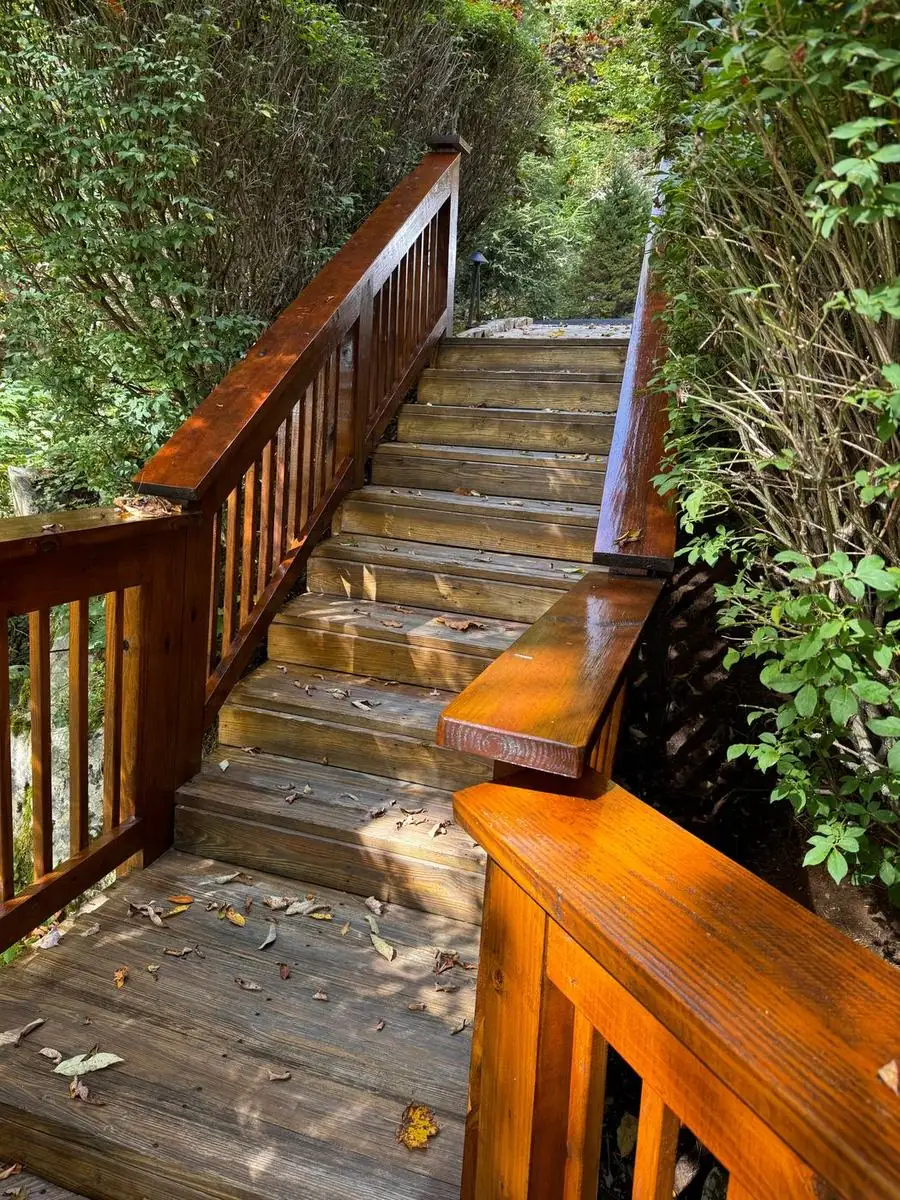 Stained wood stairs and railing after restoration at Linville Ridge in Linville