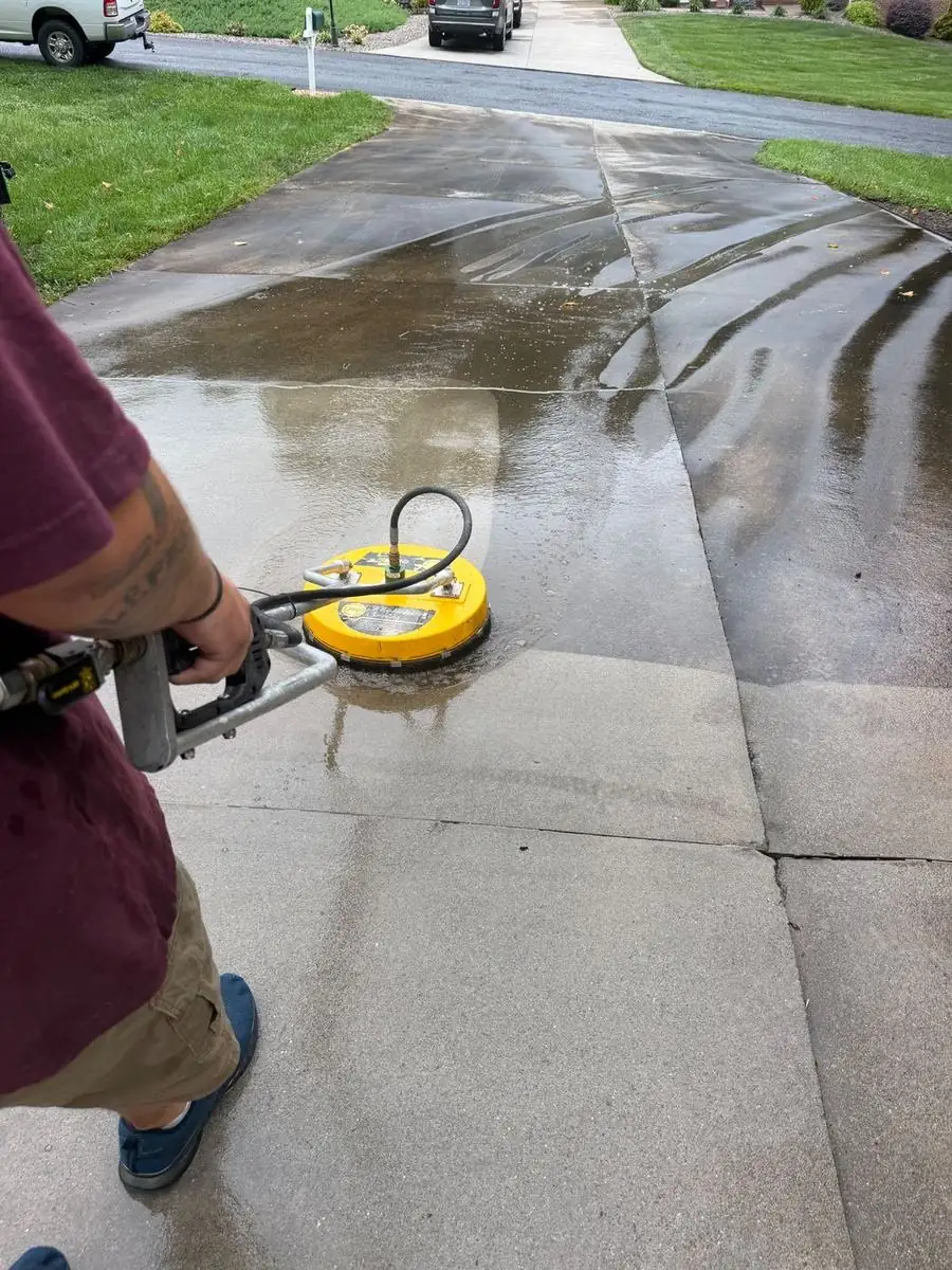 Surface cleaner cleaning a concrete driveway